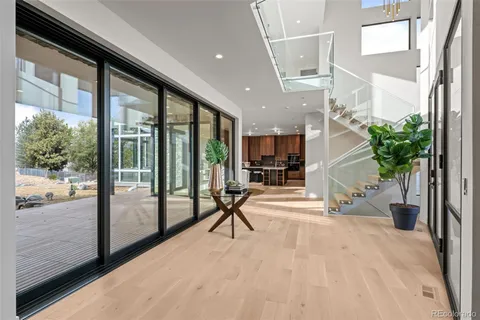 a bedroom with a large bed and a large window