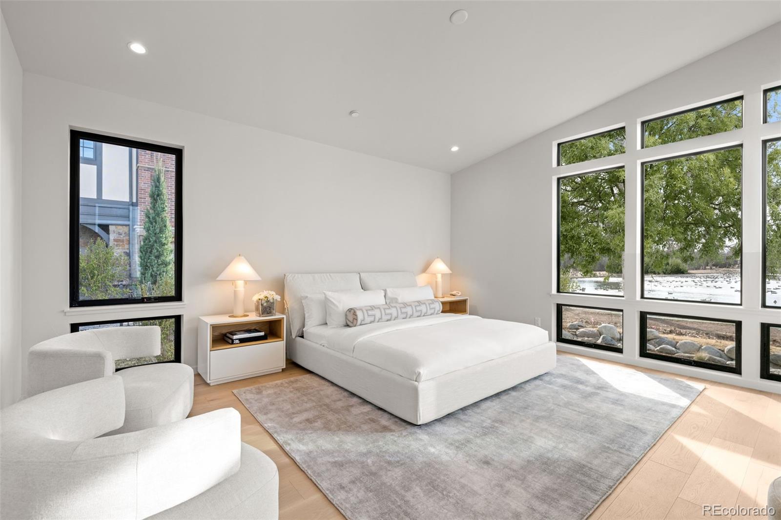 15 Sandy Lake Road Cherry Hills Village, CO 80113 - Photo 18 of 49 a bedroom with a large bed and a large window