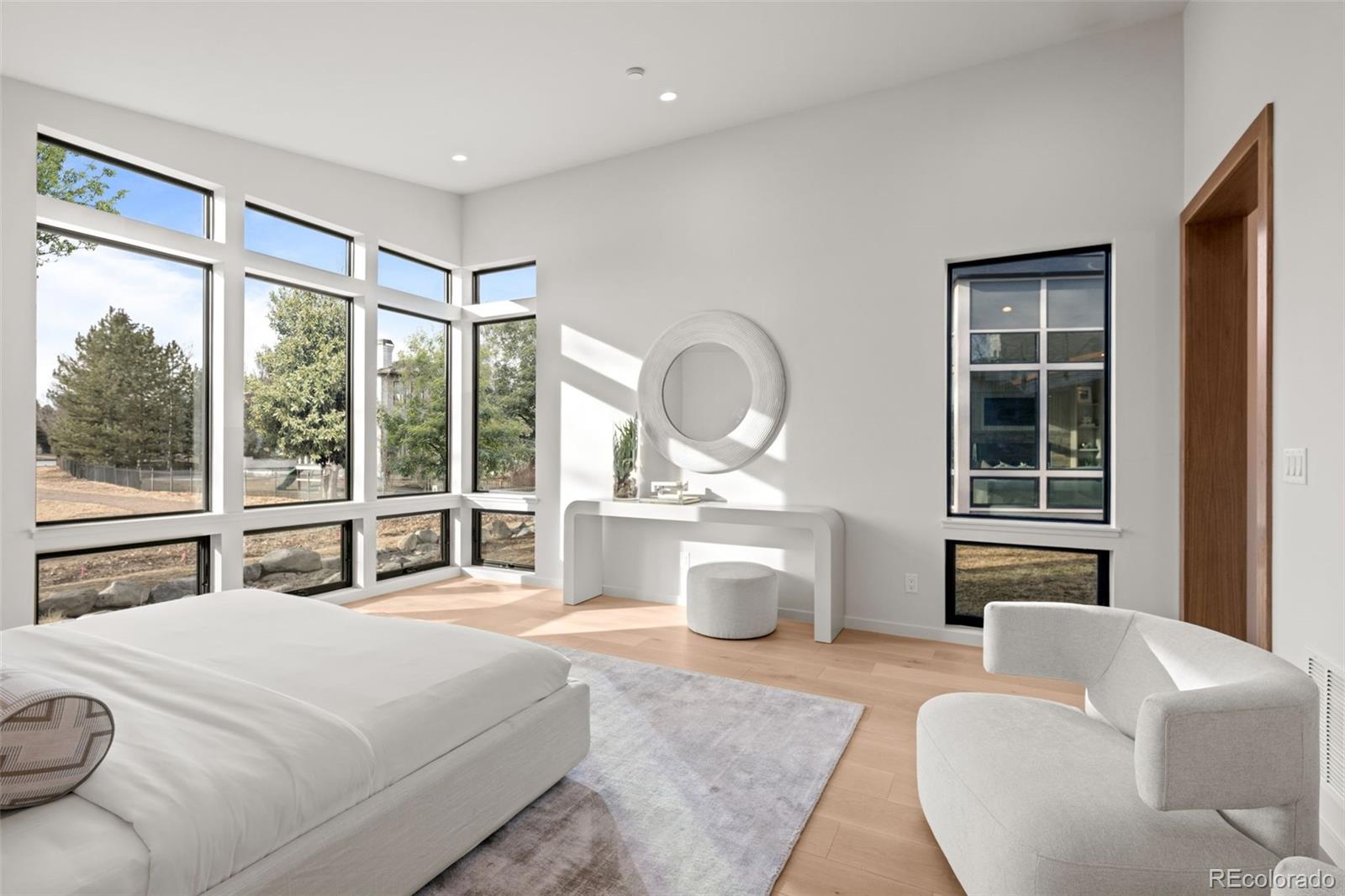 15 Sandy Lake Road Cherry Hills Village, CO 80113 - Photo 20 of 48 a bedroom with a large bed and a large window