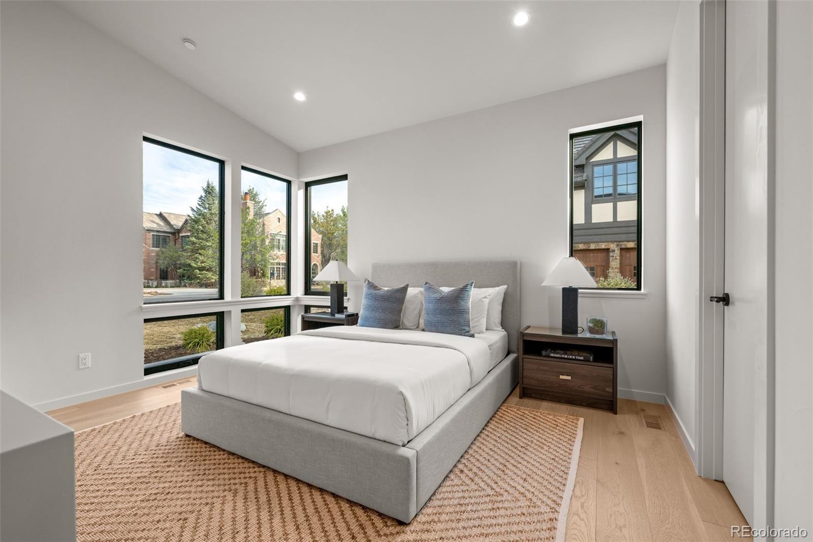 15 Sandy Lake Road Cherry Hills Village, CO 80113 - Photo 23 of 48 a bedroom with a large bed and a large window