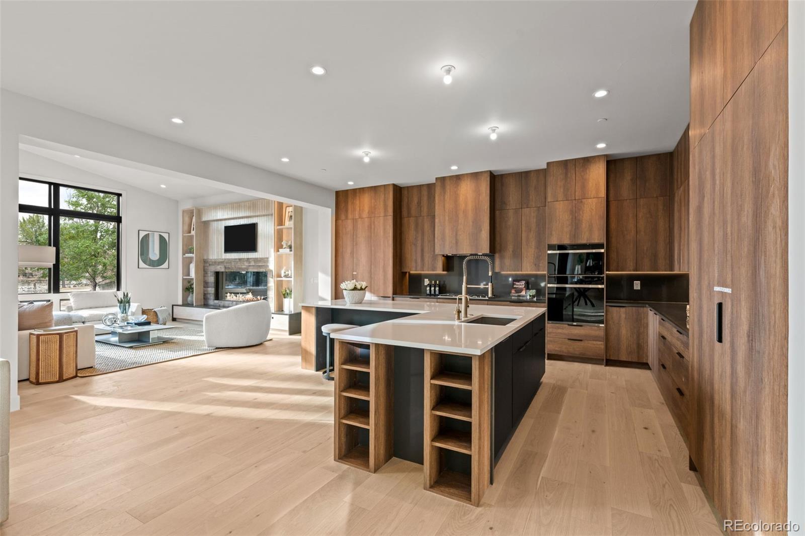 15 Sandy Lake Road Cherry Hills Village, CO 80113 - Photo 7 of 49 a kitchen with kitchen island granite countertop lots of counter top space and a sink