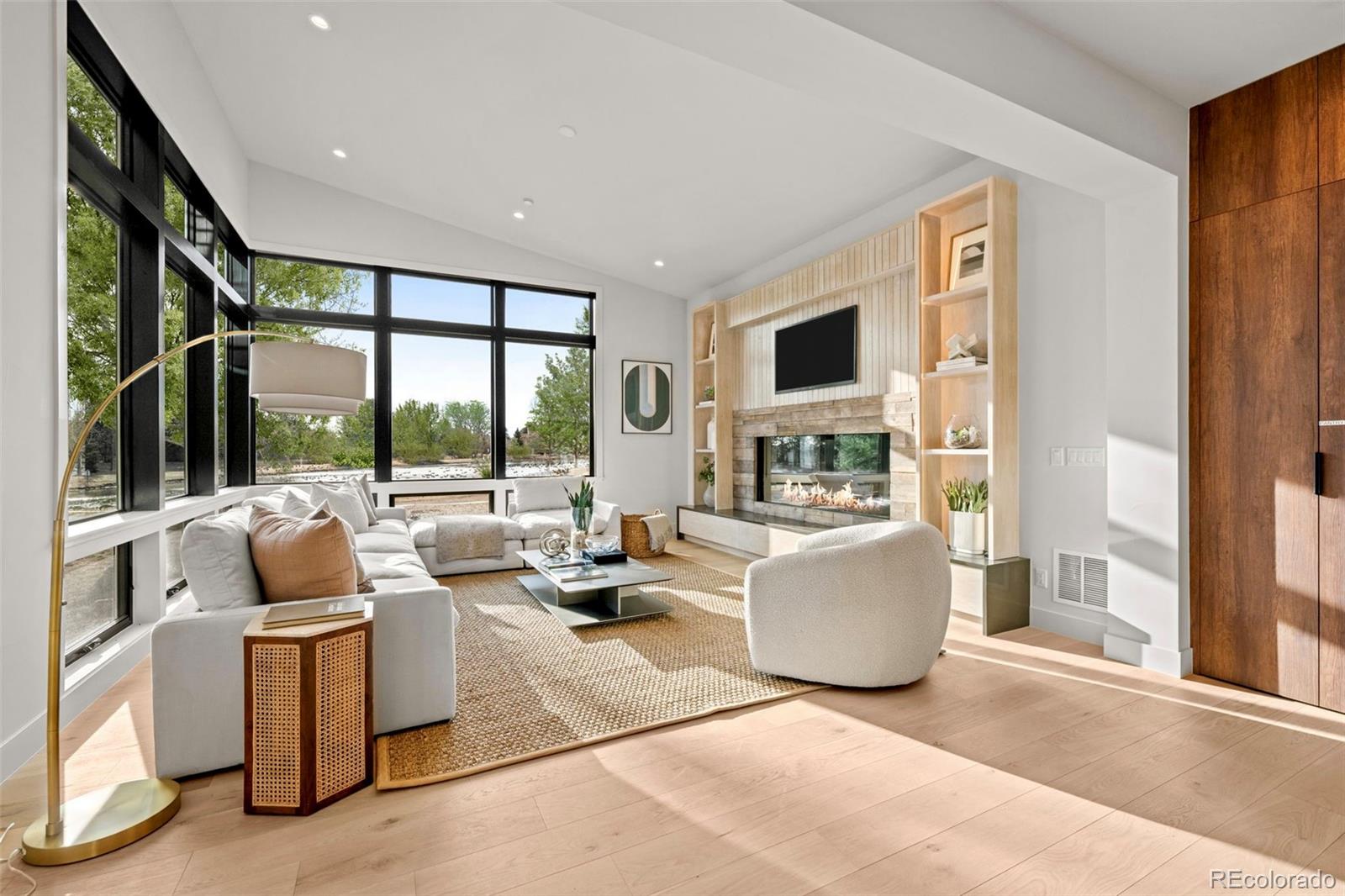 15 Sandy Lake Road Cherry Hills Village, CO 80113 - Photo 8 of 48 a living room with furniture and a large window