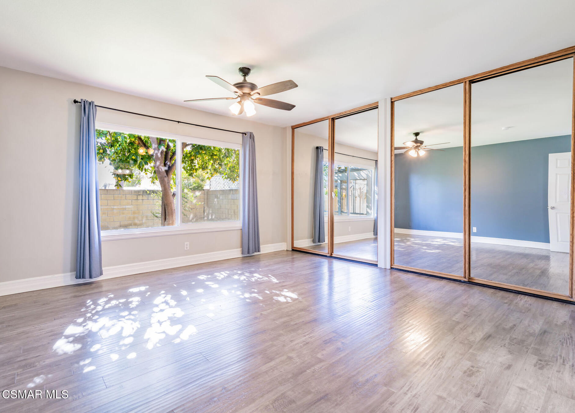 3648 Woodhaven Street Simi Valley, CA 93063 - Photo 14 of 30 a view of an empty room with wooden floor and a window