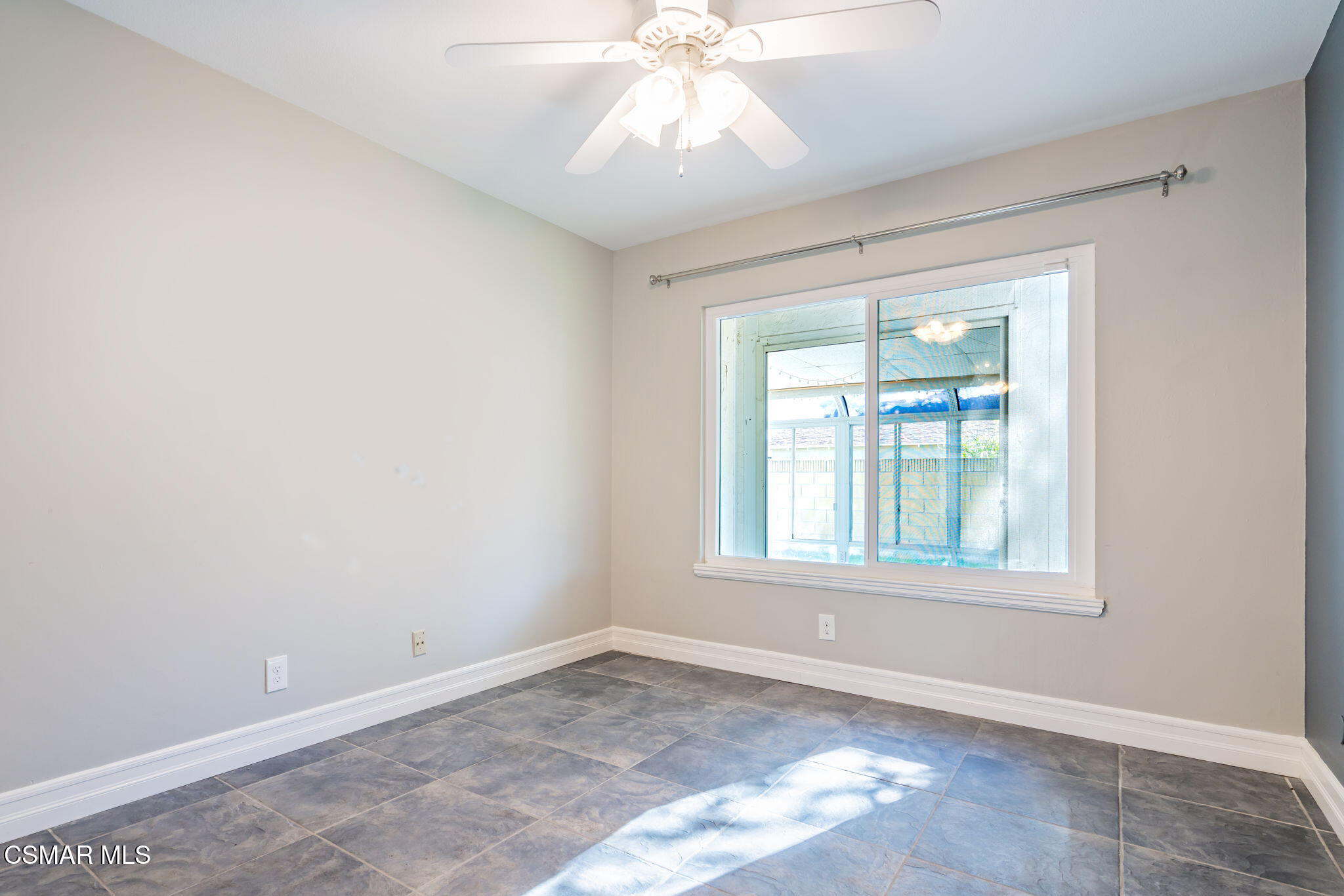 3648 Woodhaven Street Simi Valley, CA 93063 - Photo 17 of 30 an empty room with chandelier fan and windows