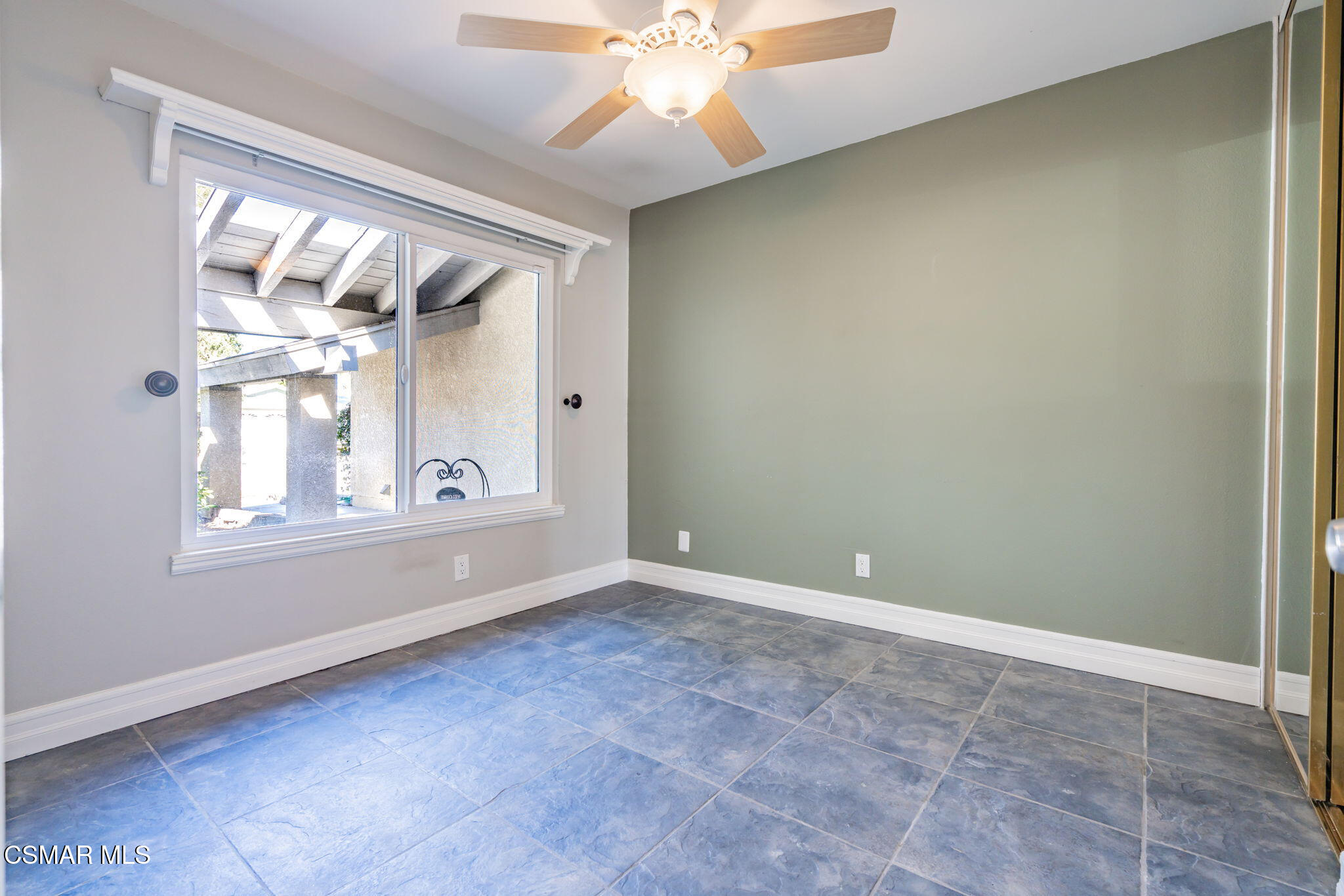 3648 Woodhaven Street Simi Valley, CA 93063 - Photo 19 of 30 an empty room with chandelier fan and windows