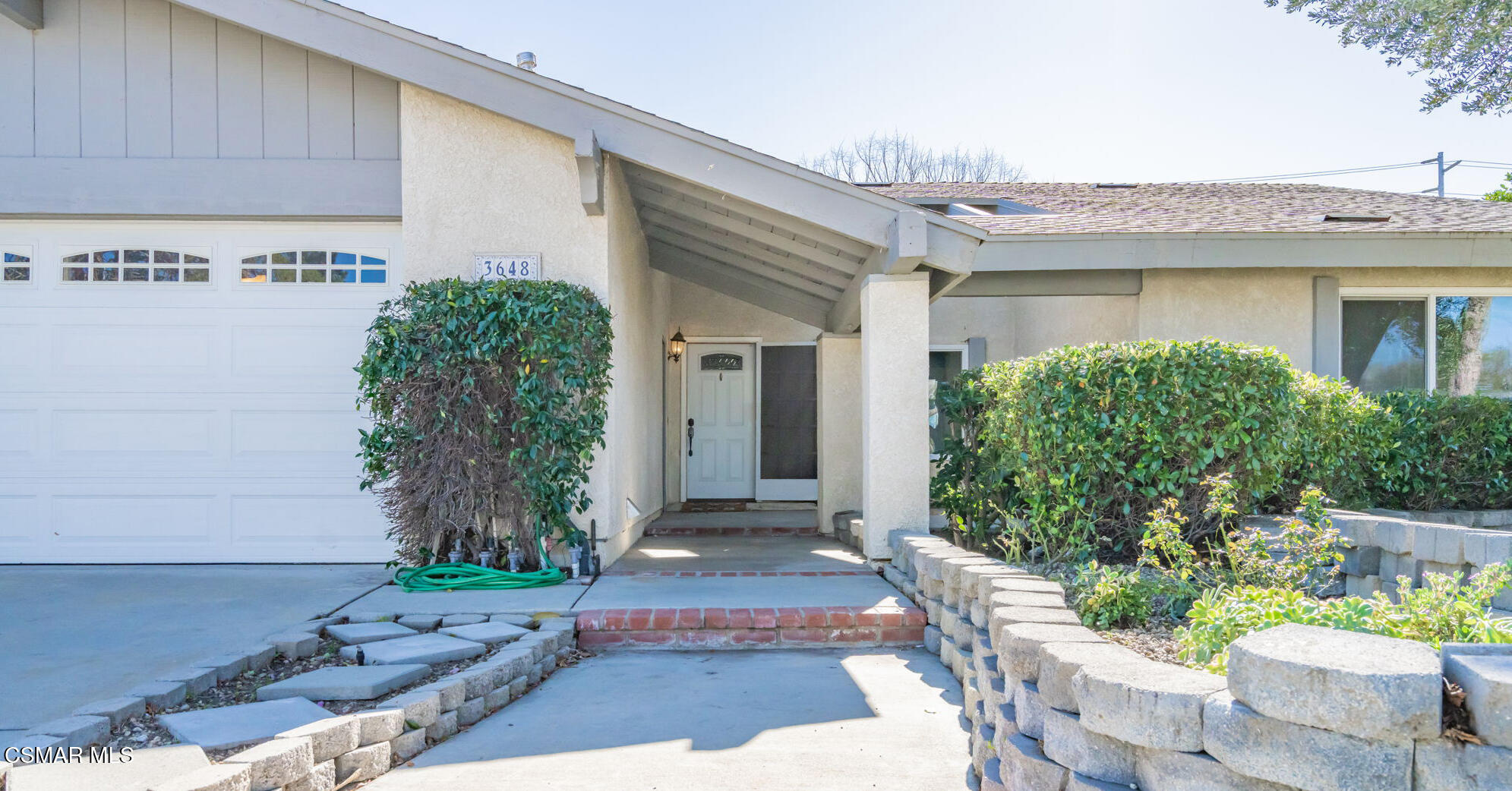 3648 Woodhaven Street Simi Valley, CA 93063 - Photo 3 of 30 a front view of a house with garden