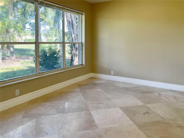 a view of a room with a large window