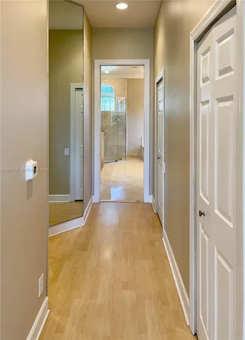 a view of a bathroom with a tub and shower