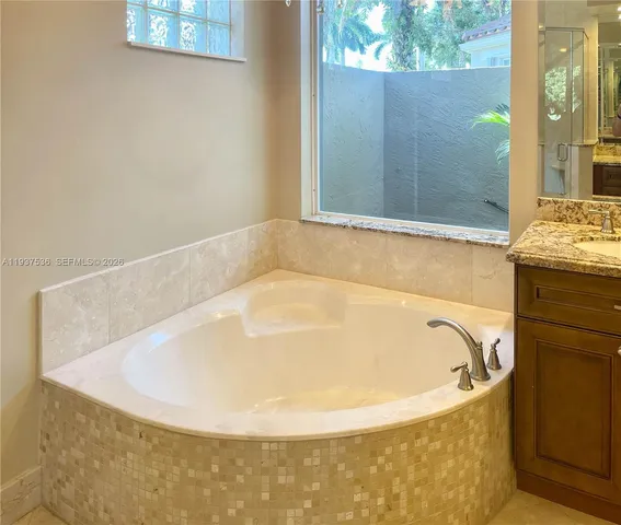 a white bath tub sitting in a bathroom