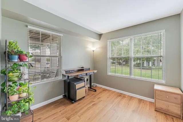 a workspace with furniture and a potted plant