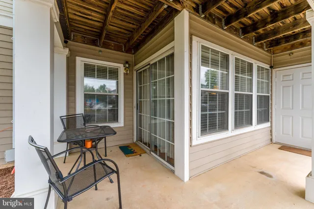 a view of a chair and table in a house