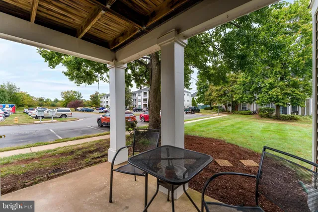 a front view of a residential apartment building with a yard