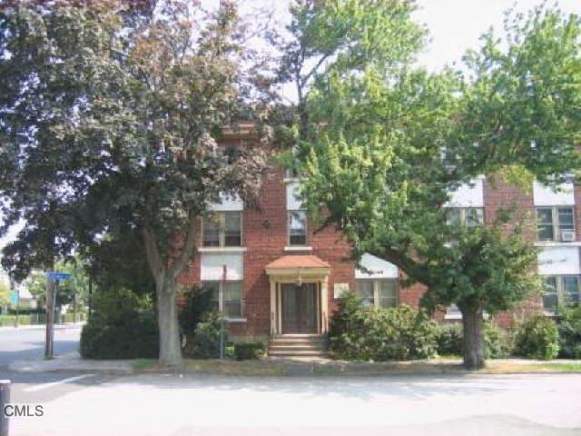 74 Circular Avenue, Unit 2B Bridgeport, CT 06605 - Photo 1 of 1 front view of a house with a small yard