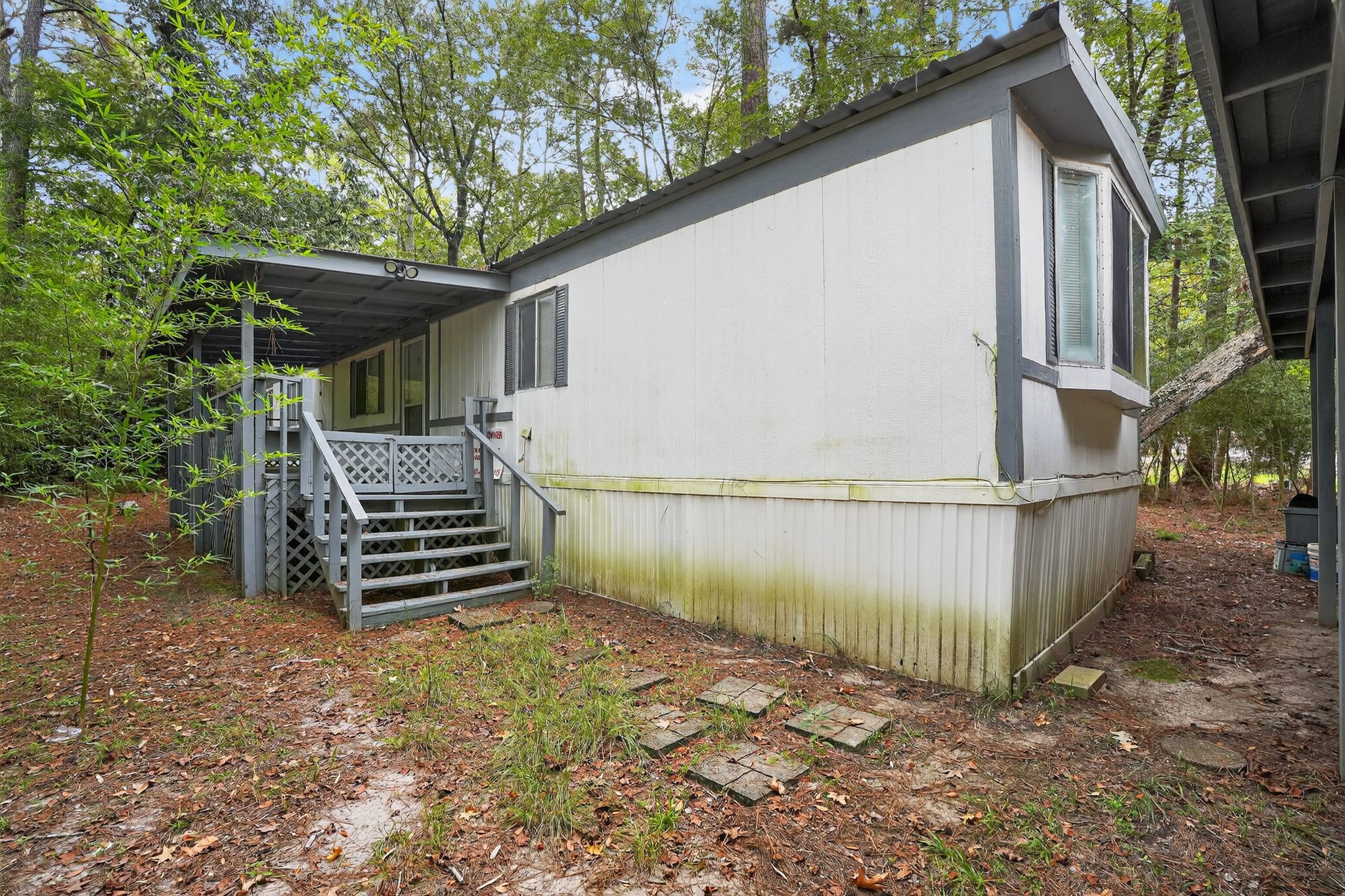 3 Meadowlark Trinity, TX 75862 - Photo 20 of 22 a backyard of a house with wooden floor and outdoor seating
