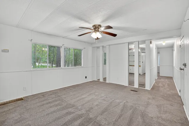 a view of an empty room with a window