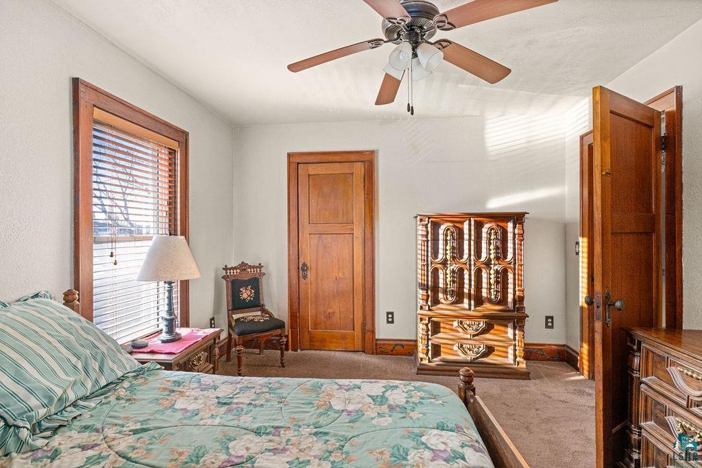 1505 North 19th Street Superior, WI 54880 - Photo 16 of 18 Bedroom with dark colored carpet and a ceiling fan