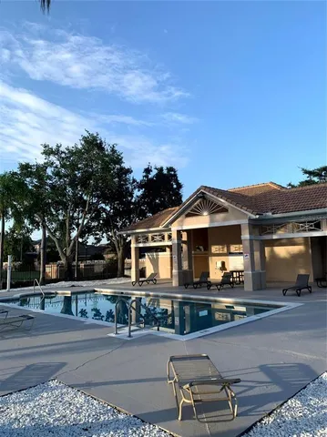 a front view of a house with sitting area