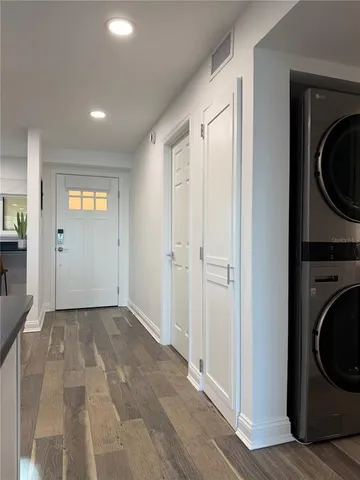 a view of a hallway with washer and dryer