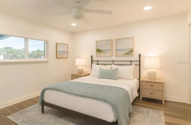 a bedroom with a bed and a night stand