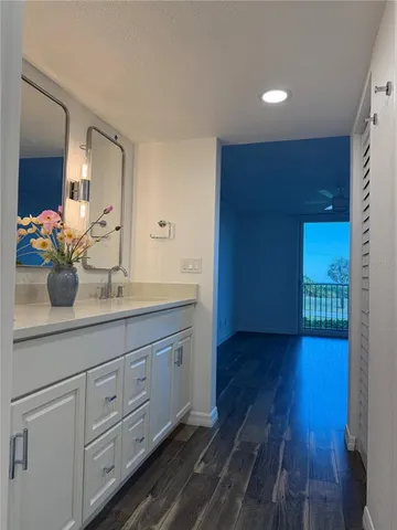 a bathroom with a sink and mirror