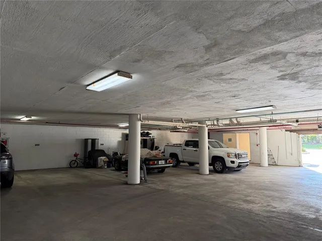 a view of parking area with parked cars