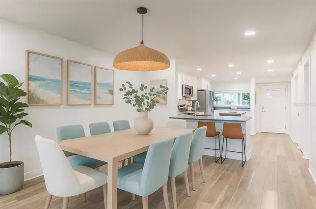 a view of a dining room with furniture window and wooden floor