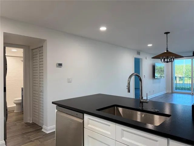 a kitchen with a sink and cabinets
