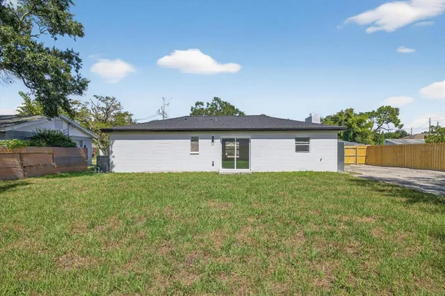 a view of backyard with green space