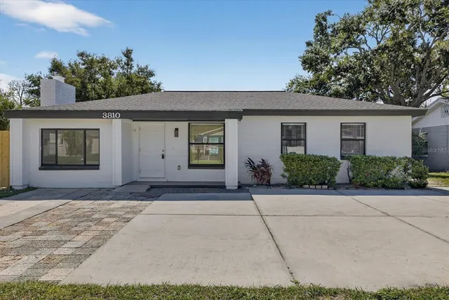 a front view of house with yard and seating area