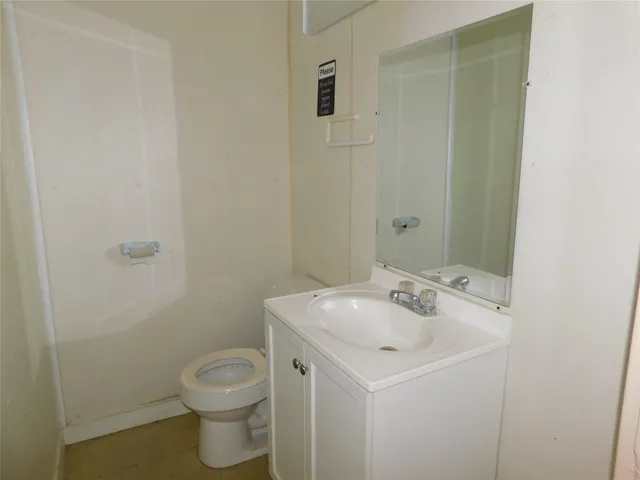 a bathroom with a sink toilet and vanity