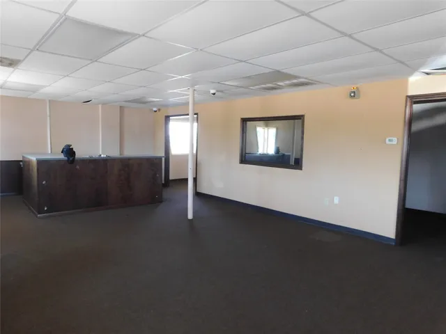 a view of a livingroom with furniture and staircase