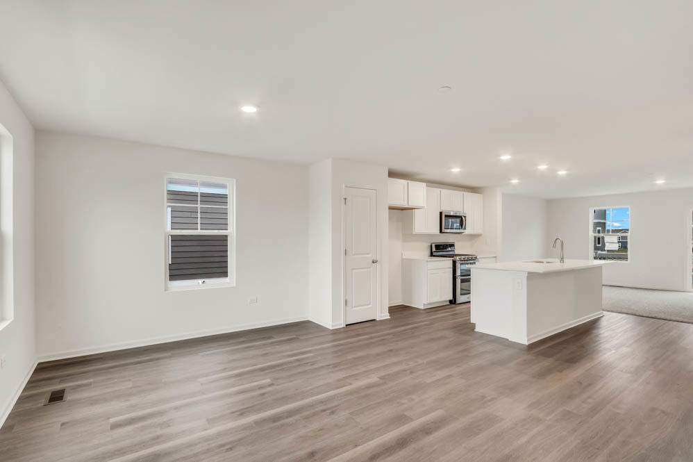 369 Bridgeview Court St. Charles, IL 60174 - Photo 6 of 44 a view of kitchen with wooden floor and electronic appliances