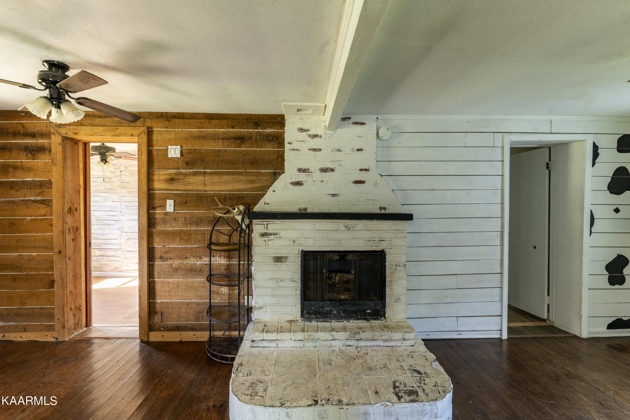 982 Salem Valley Road Ten Mile, TN 37880 - Photo 6 of 30 an empty room with wooden floor fireplace and windows
