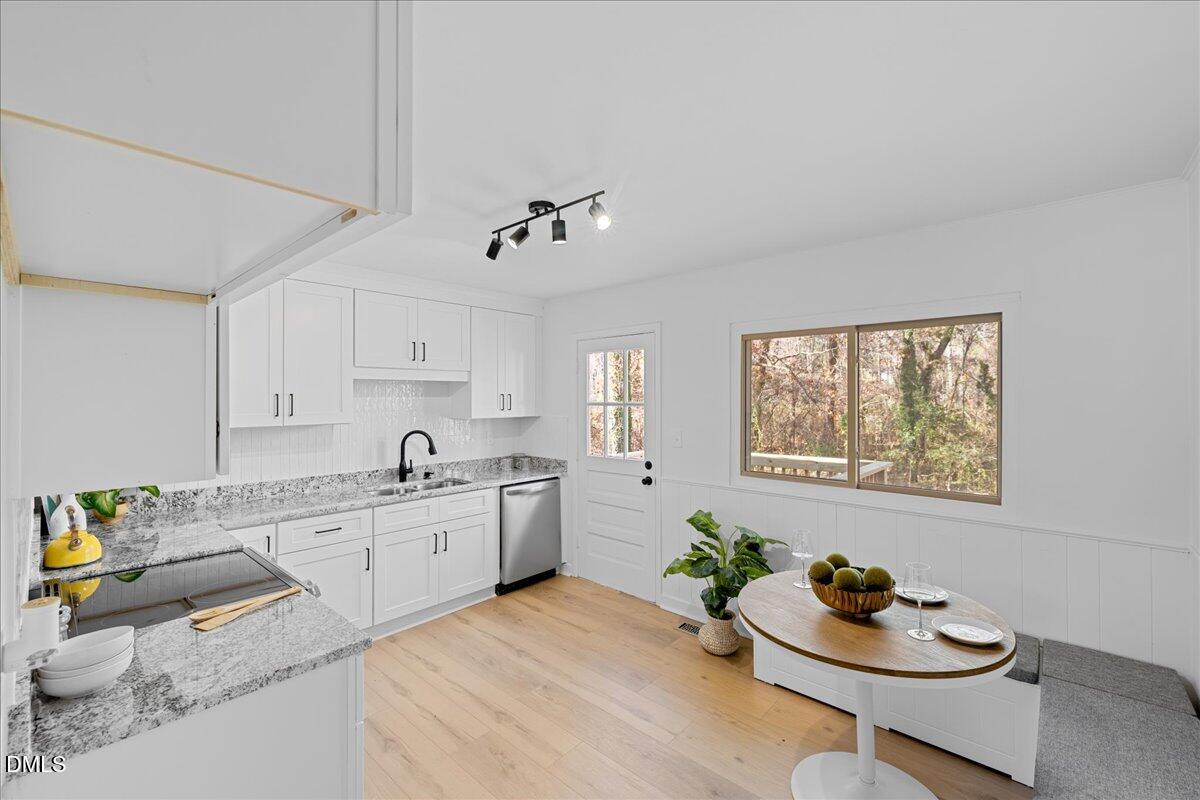 1406 Valley Road Garner, NC 27529 - Photo 11 of 39 a kitchen with a sink cabinets and window