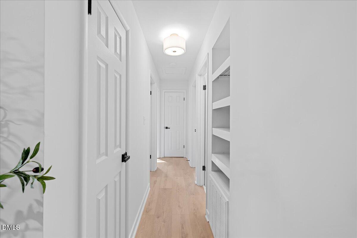 1406 Valley Road Garner, NC 27529 - Photo 17 of 39 a view of a hallway with closet