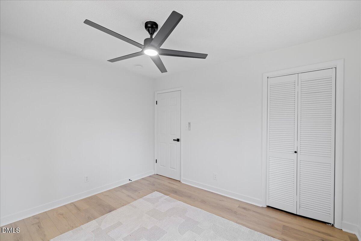 1406 Valley Road Garner, NC 27529 - Photo 22 of 39 a view of a big room with wooden floor