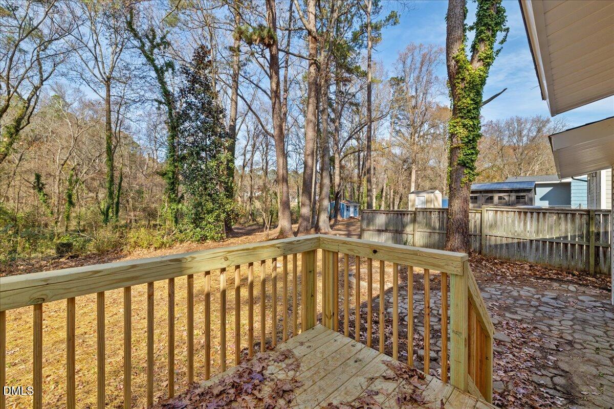 1406 Valley Road Garner, NC 27529 - Photo 27 of 39 a view of a balcony with wooden fence