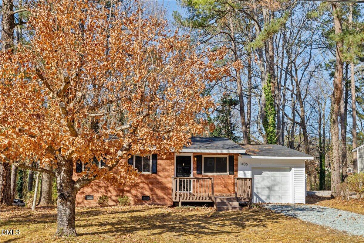 1406 Valley Road Garner, NC 27529 - Photo 3 of 39 a front view of a house with a yard