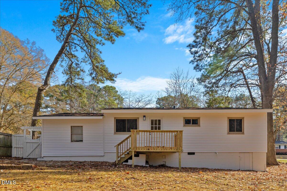 1406 Valley Road Garner, NC 27529 - Photo 32 of 39 a view of a house with a backyard