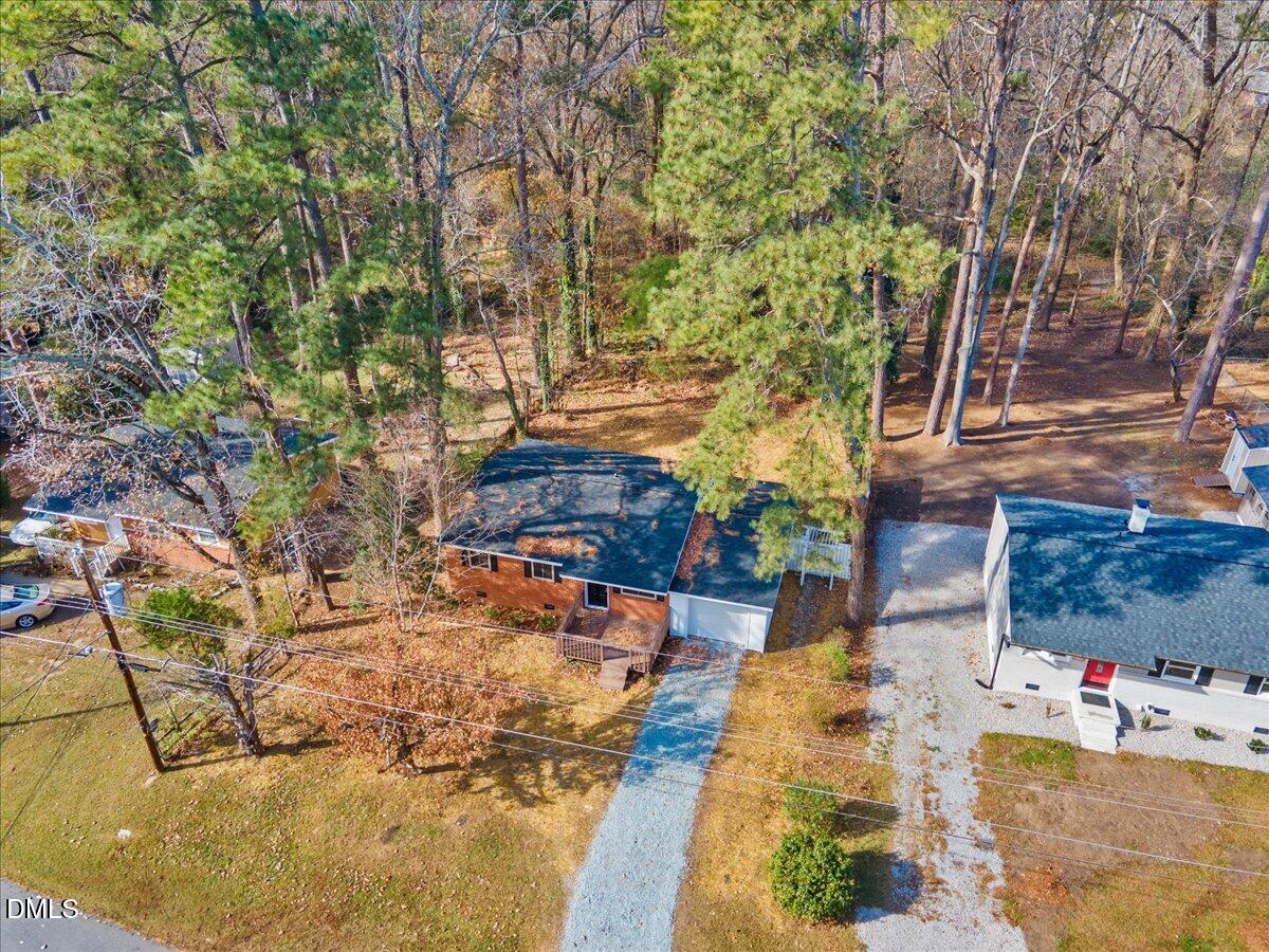 1406 Valley Road Garner, NC 27529 - Photo 37 of 39 a backyard of a house with table and chairs
