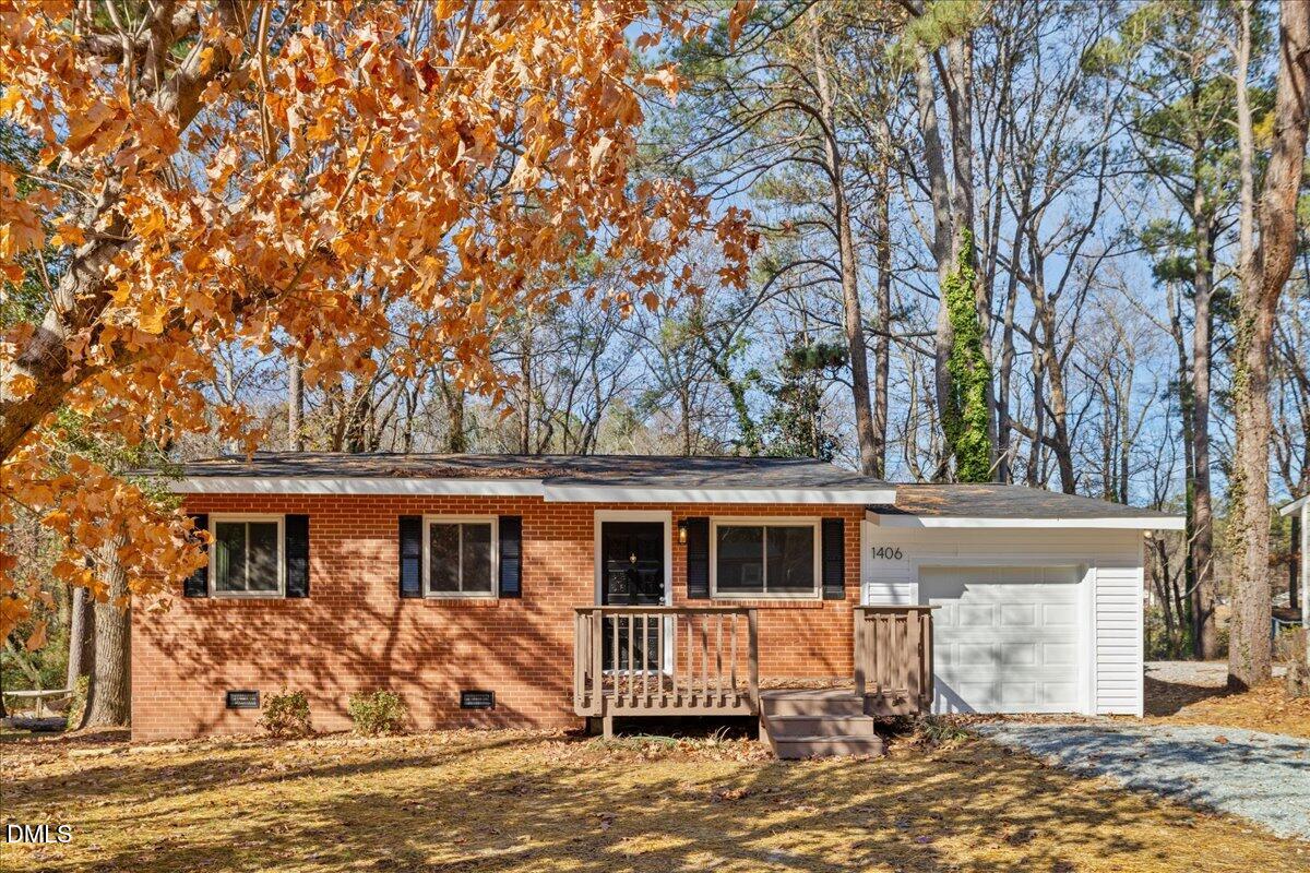 1406 Valley Road Garner, NC 27529 - Photo 5 of 39 a front view of a house with a yard