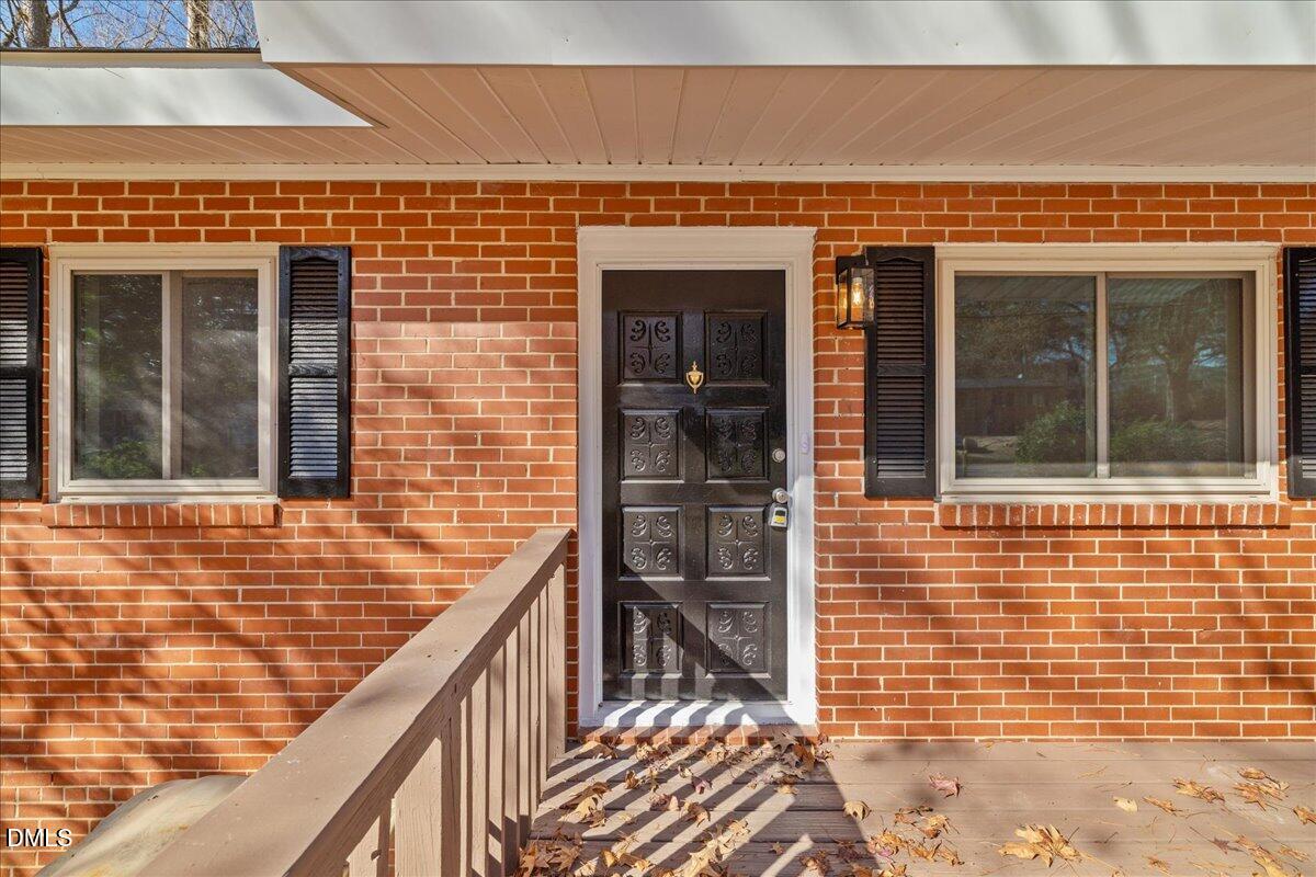 1406 Valley Road Garner, NC 27529 - Photo 6 of 39 a view of entrance door of the building
