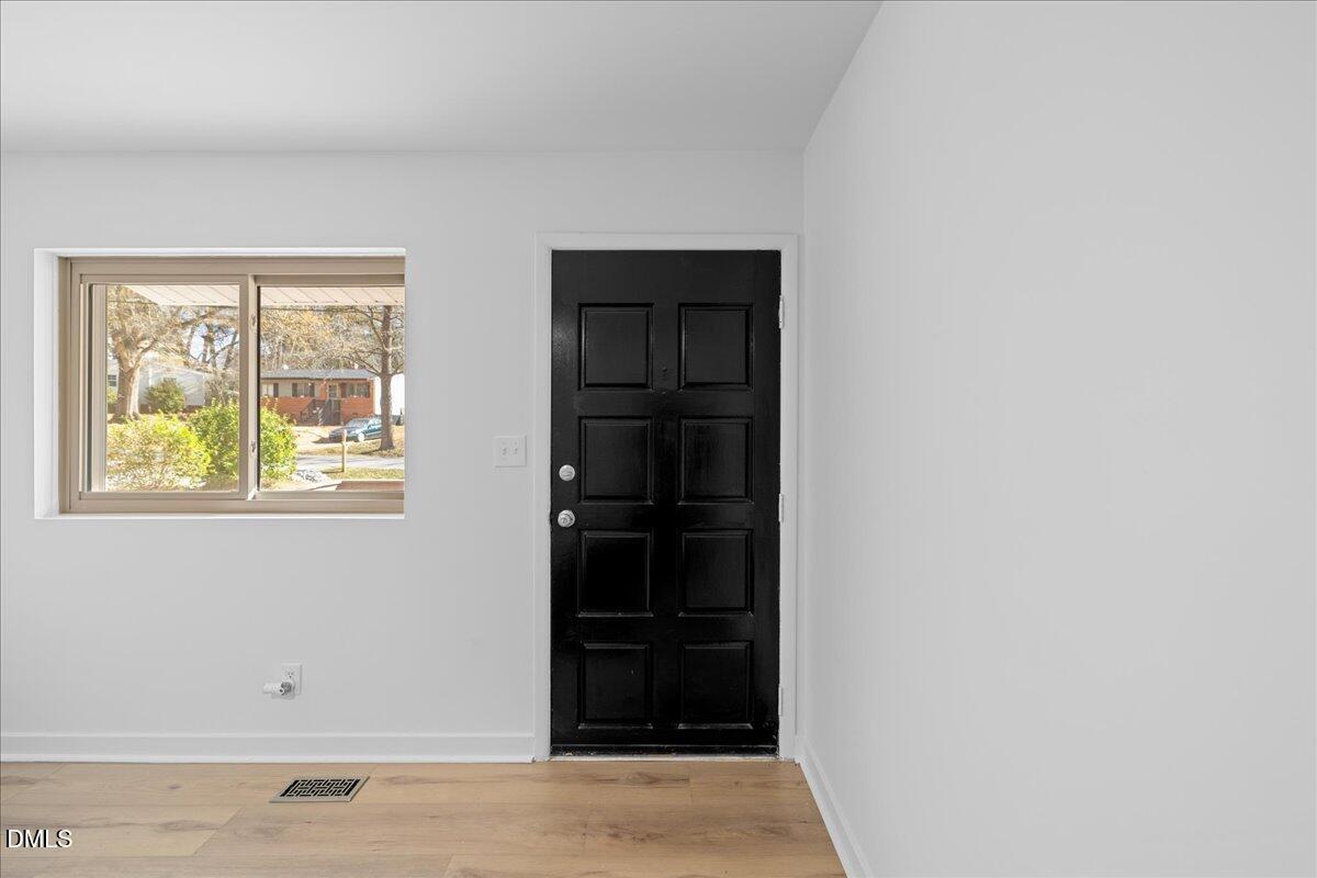 1406 Valley Road Garner, NC 27529 - Photo 7 of 39 a view of an entryway of the house