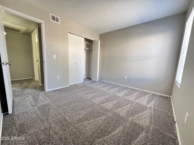 an empty room with a bathroom