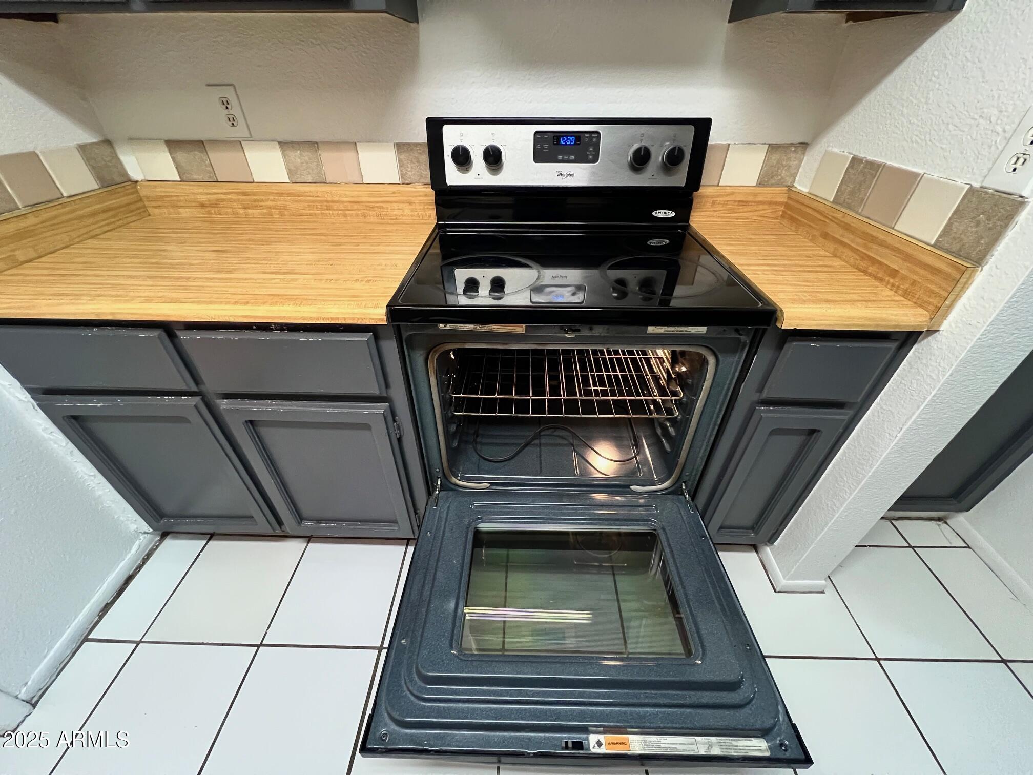 1927 East Hampton Avenue, Unit 136 Mesa, AZ 85204 - Photo 17 of 26 a view of kitchen with a stove