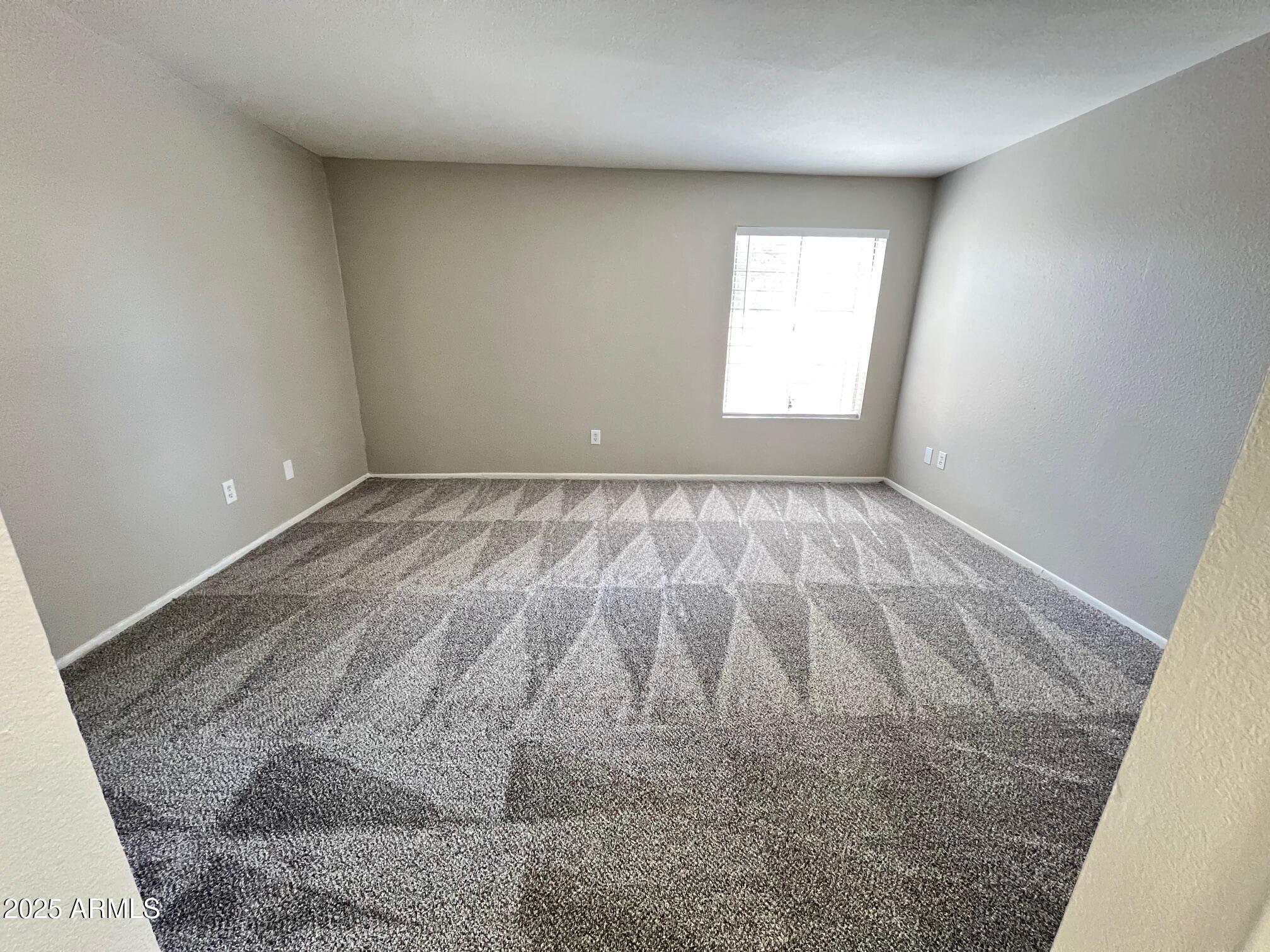 1927 East Hampton Avenue, Unit 136 Mesa, AZ 85204 - Photo 19 of 26 an empty room with window