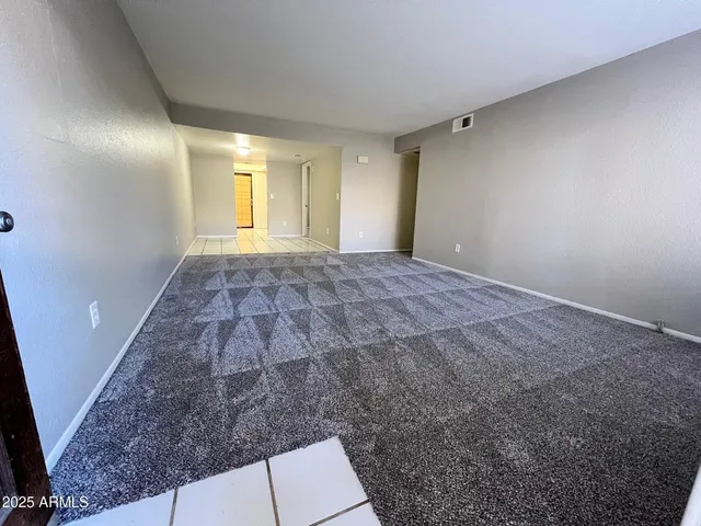 a view of an empty room and window