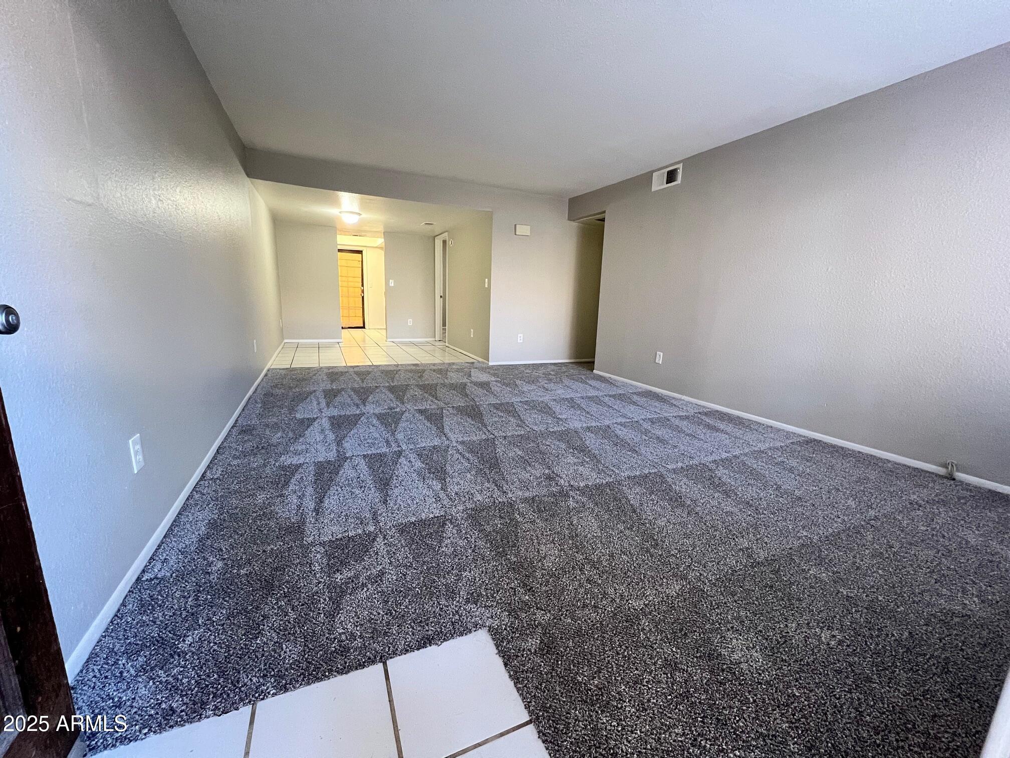 1927 East Hampton Avenue, Unit 136 Mesa, AZ 85204 - Photo 2 of 26 a view of an empty room and window