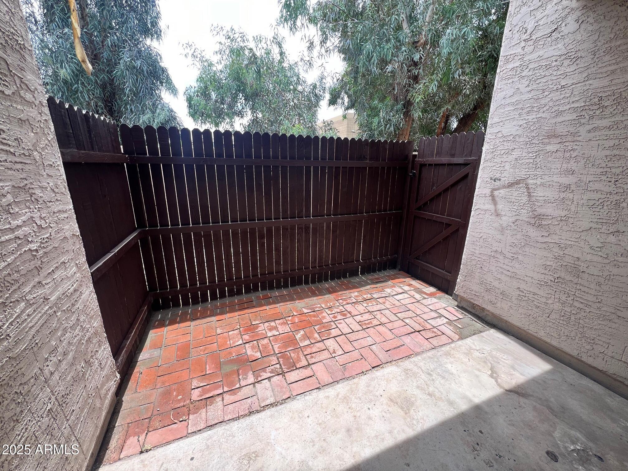 1927 East Hampton Avenue, Unit 136 Mesa, AZ 85204 - Photo 22 of 26 a view of wooden fence