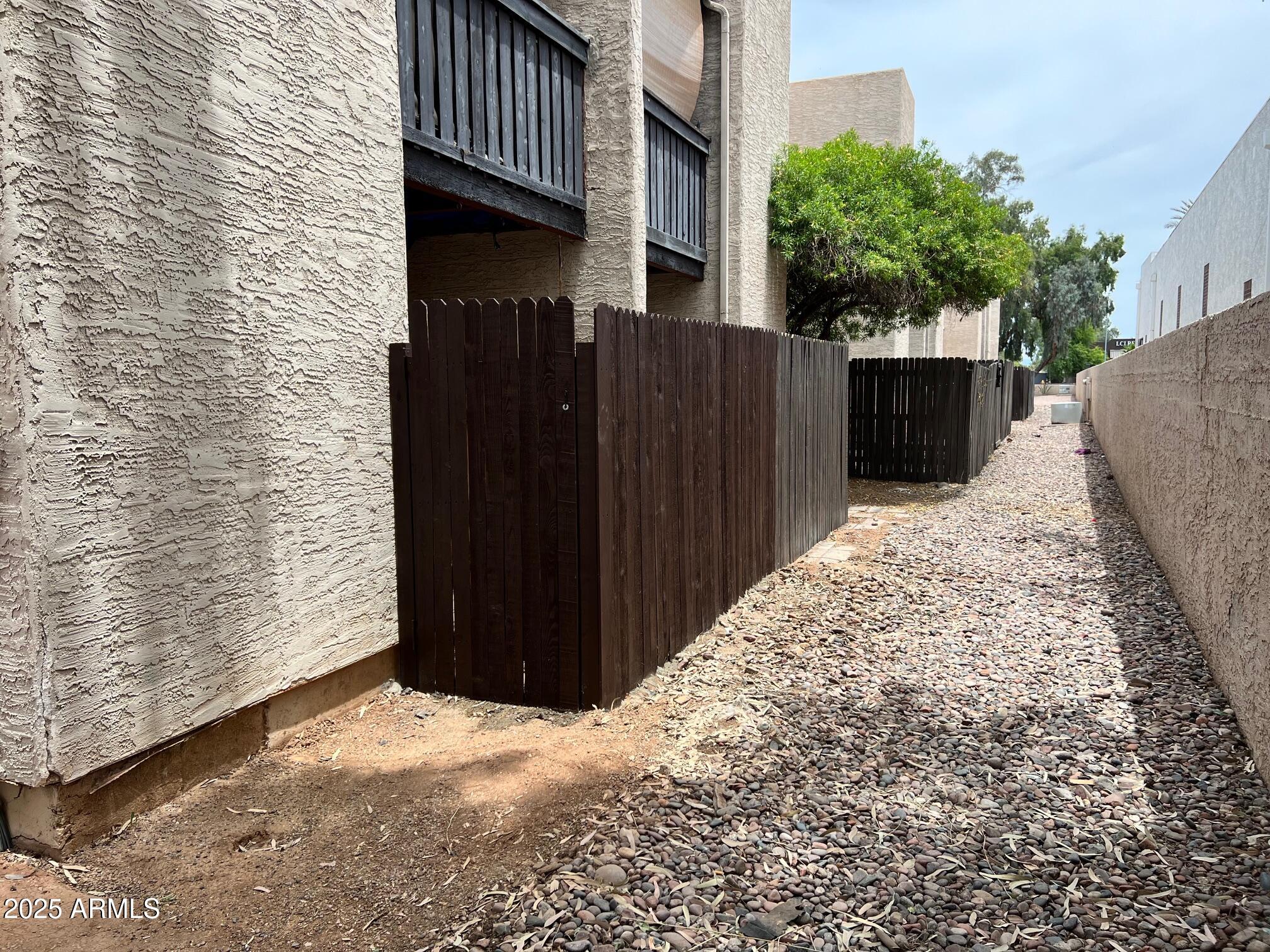 1927 East Hampton Avenue, Unit 136 Mesa, AZ 85204 - Photo 25 of 26 a view of a pathway of a building